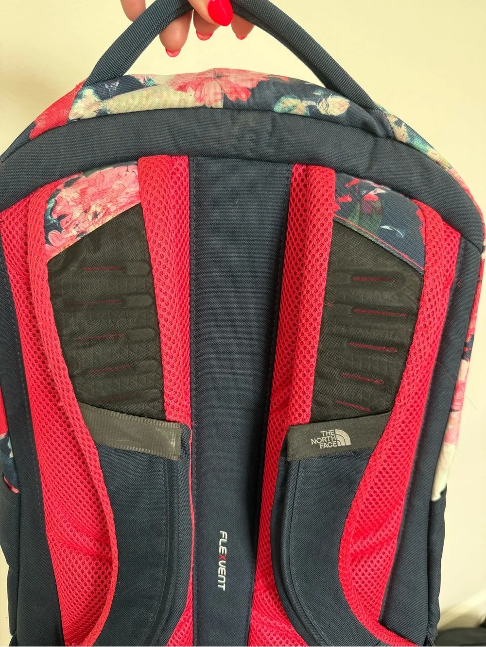 The North Face Navy Backpack with Pink Floral Top